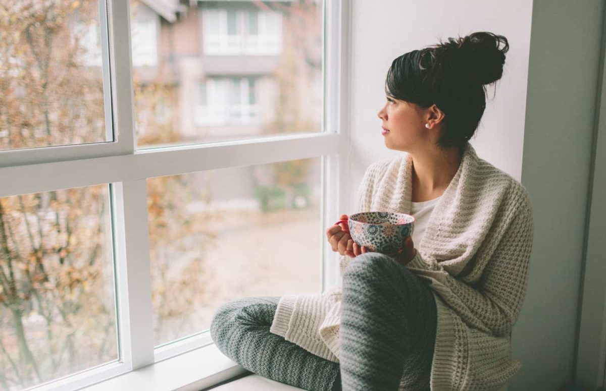 woman-sitting-looking-outside